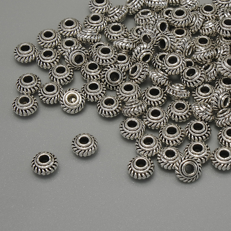 Furnitura jubilerska – koralik-wstawka, kolor metalu: srebrny, średnica 5×3 mm ± otwór 1,8 mm ± opakowanie 20 g (~102 szt.)