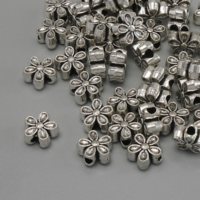 Koralik-wstawka „Kwiat” kolor srebrny, średnica 7×3 mm ± otwór ~2 mm ± opakowanie 20 g (~44 szt.)