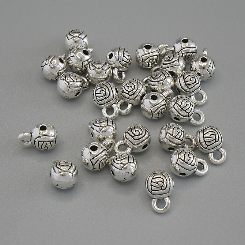 Zawieszka bail, kolor metalu: srebrzysty, wymiary 6×9 mm, otwory Ø około 1,7–2 mm, opakowanie 20 g, 25 szt.