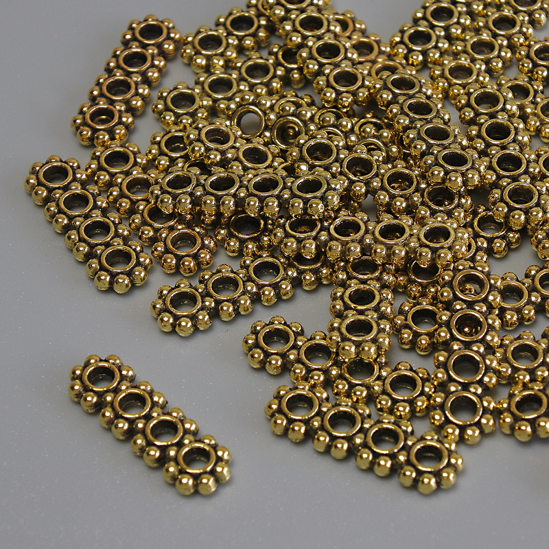 Rozdzielacz rzędów, wstawka w kolorze złotego metalu, średnica 16 × 5 × 2 mm, otwór 2 mm, opakowanie 20 g (~36 szt.)