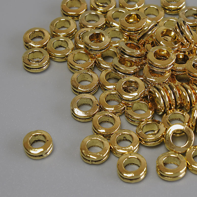 Koralik-wstawka w kolorze złota, średnica 6×2,5 mm, otwór około 3,5 mm, opakowanie 20 g (~74 szt.)