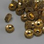 Koralik-wkładka w kolorze ciemnego złota, średnica 7,5×3,5 mm ± otwór 2,3 mm ± opakowanie 20 g (~35 szt.)