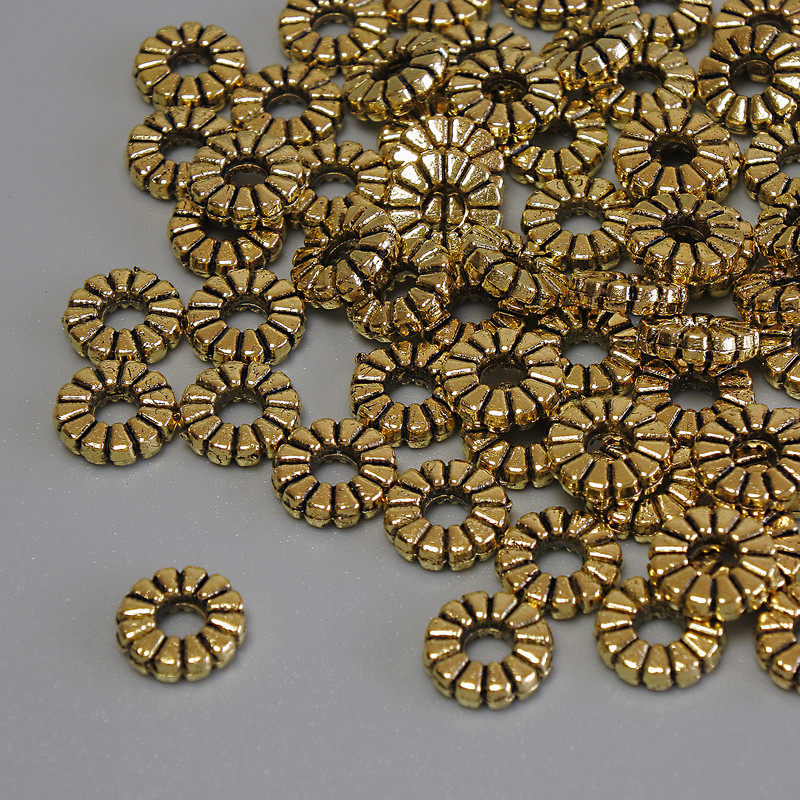 Koraliki-wkstawki w kolorze złotym, średnica 7×2 mm, otwór 2,5 mm, opakowanie 20 g (~67 szt.)