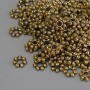 Koraliki-wstawki w kolorze złotego metalu, średnica 6×1,5 mm, otwór 2 mm, opakowanie 20 g (~132 szt.)