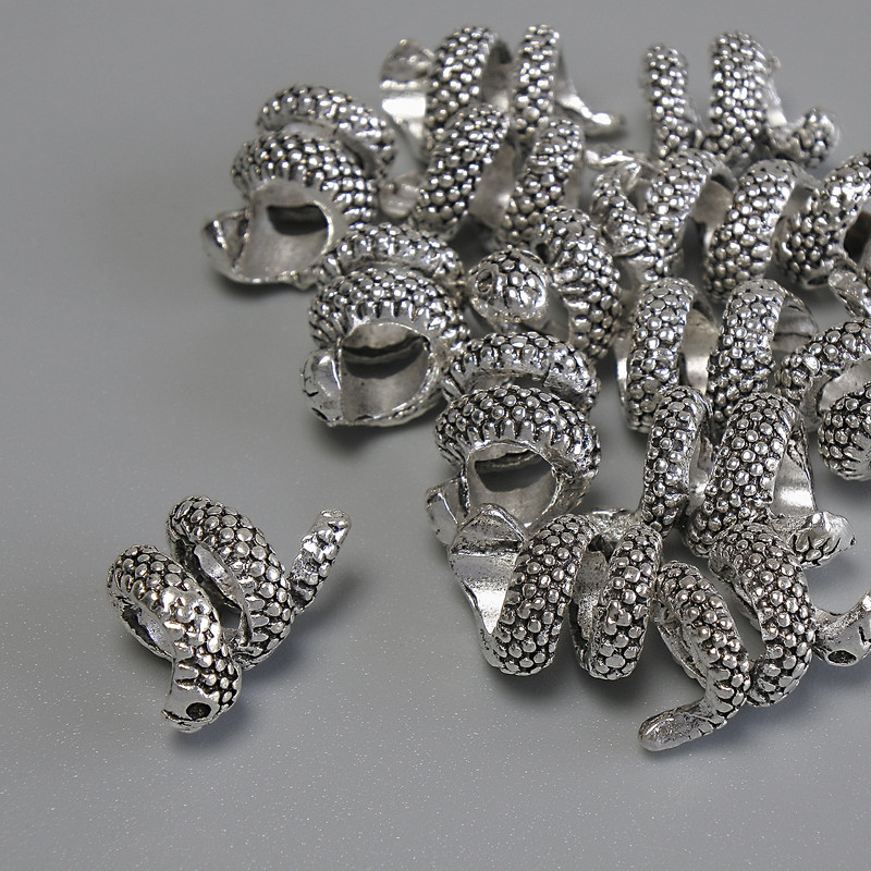 Koralik-wstawka „Wąż” w kolorze srebrnym, średnica 13×8 mm, otwór około 4,5 mm, opakowanie 20 g (~14 szt.)