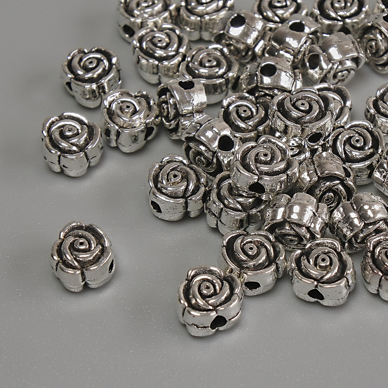 Koralik-wstawka „Kwiat” srebrzysty, kolor metalu: srebro, średnica 6×4 mm, otwór około 1,7 mm, opakowanie 20 g (~37 szt.)