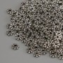 Koralik-wstawka w kolorze srebra, średnica 4×1,5 mm, otwór 1,5 mm, opakowanie 20 g (~279 szt.)