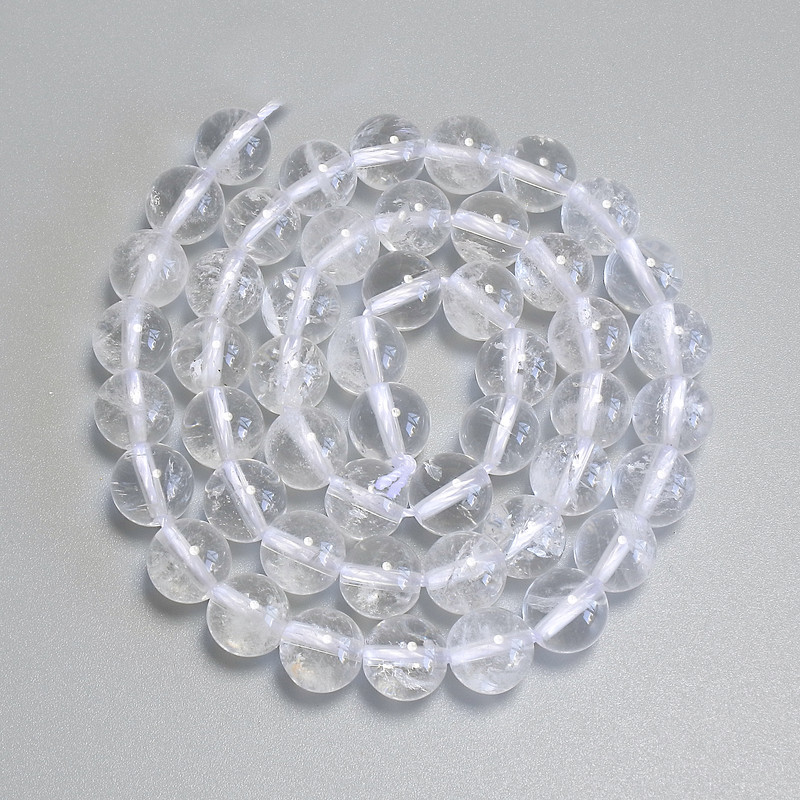 Koraliki z górskiego kryształu — gładkie kulki, średnica około 8 mm, na nitce, długość 38 cm+