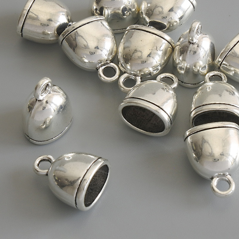 Zawieszka-wisiorek „Dzwoneczek” kolor metalu – srebrny, średnica 14×11 mm, opakowanie 12 szt.