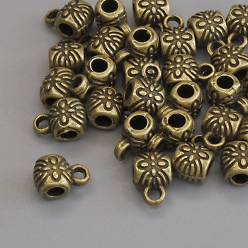 Zawieszka bail w kolorze metalu brązowym, rozmiary 8,5×6 mm ±, otwory, średnica 2,8 mm ±, średnica 1,8 mm ±, pakowanie 20 g (~28 szt.)
