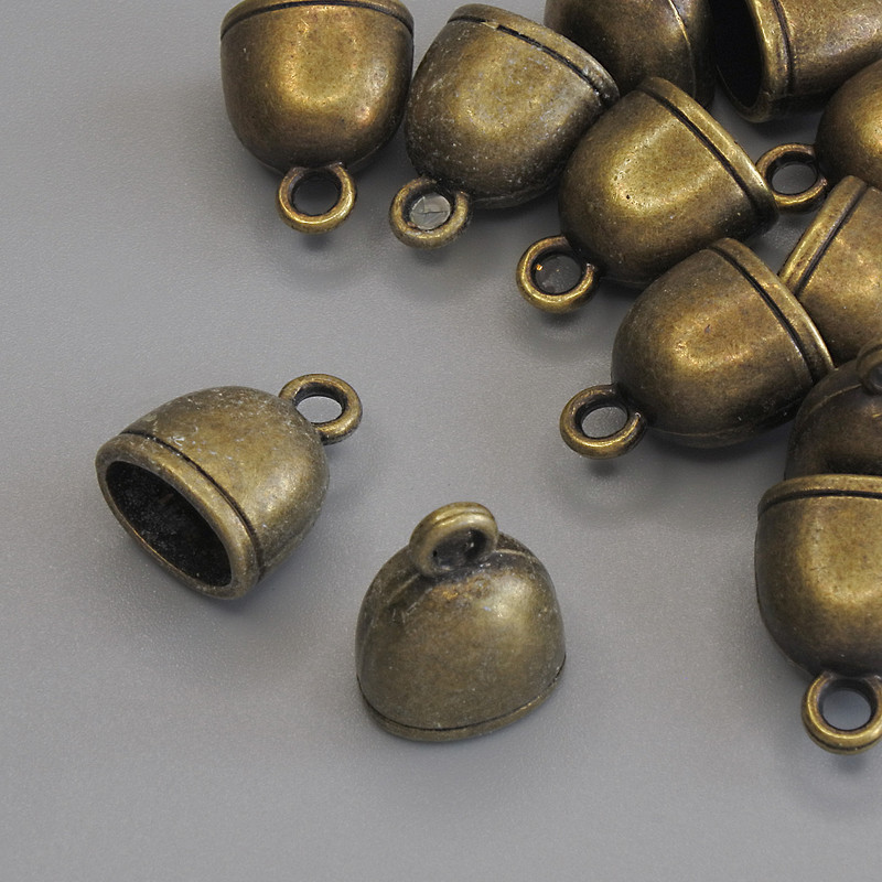Wisiorek 'Dzwon' w kolorze starego brązu, średnica 14×11 mm, opakowanie 12 szt.