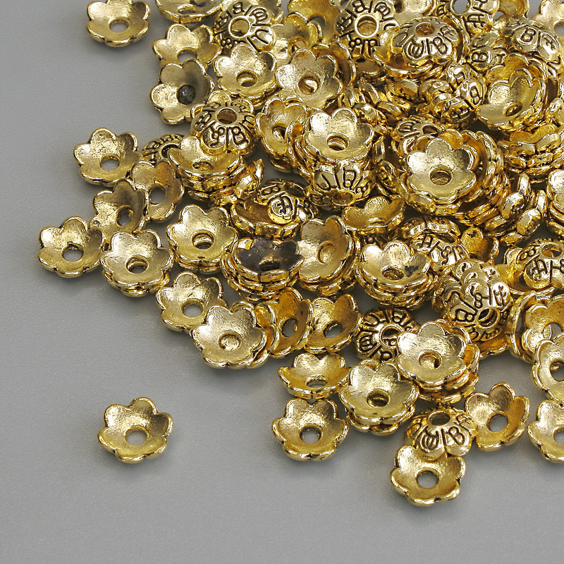 Kapturek do koralika, kolor złoty, średnica 6×1 mm ±, otwór Ø 1,5 mm ±, opakowanie 20 g (~149 szt.)