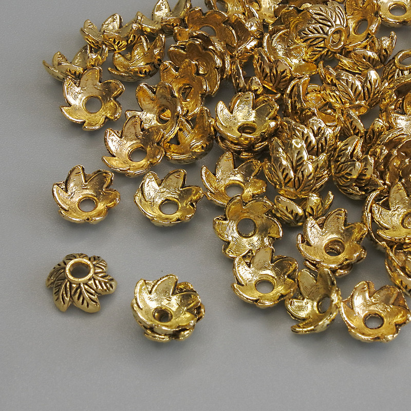 Czapeczka do koralików, złoty kolor metalu, średnica 7×1 mm ± otwór, średnica 1,2 mm ± opakowanie 20 g (~70 szt.)