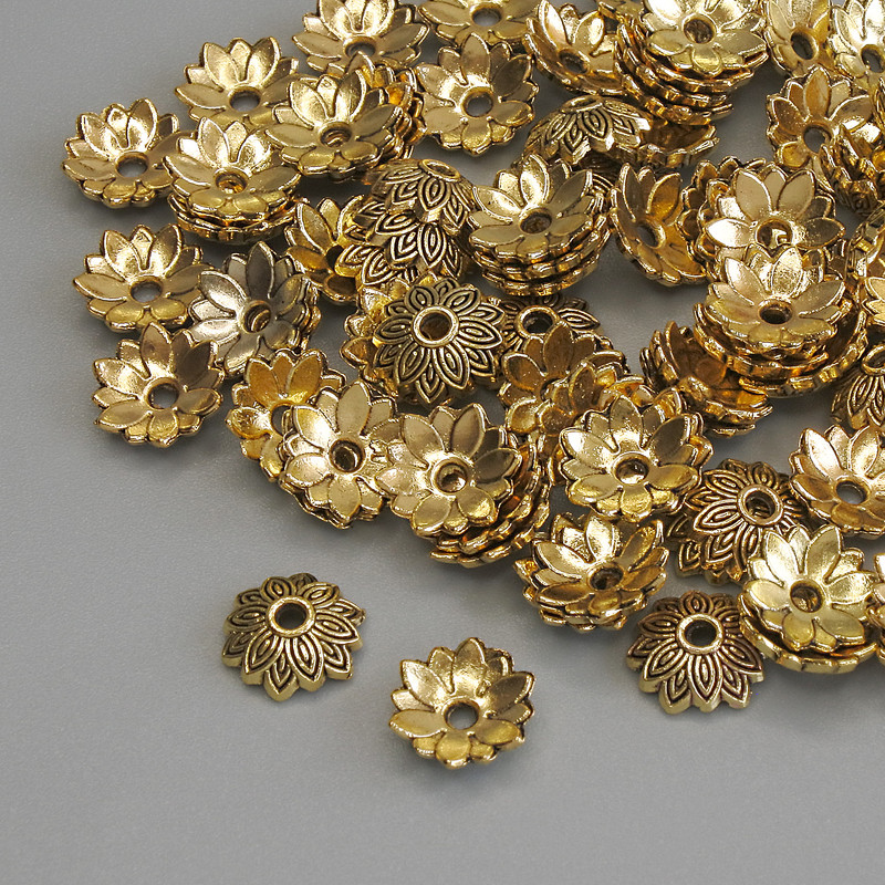 Czapeczki do koralików, kolor metalu złoty, średnica 7×1 mm ± otwór, średnica 1 mm ± opakowanie 20 g (~86 szt.)