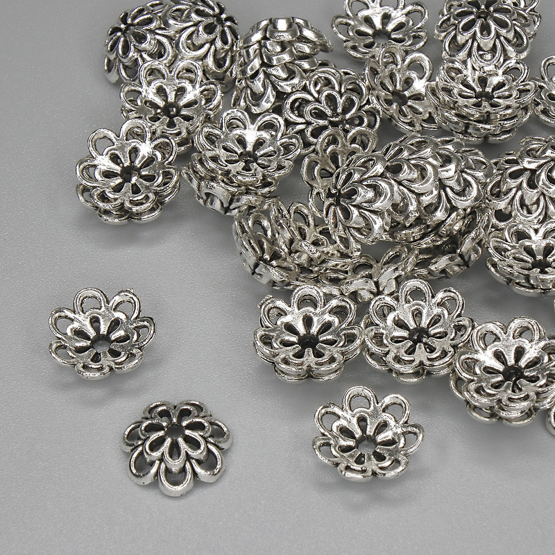 Kapturek do koralików w kolorze srebrnym, średnica 10 mm ± otwór 1,5 mm ± opakowanie 20 g (~55 szt.)