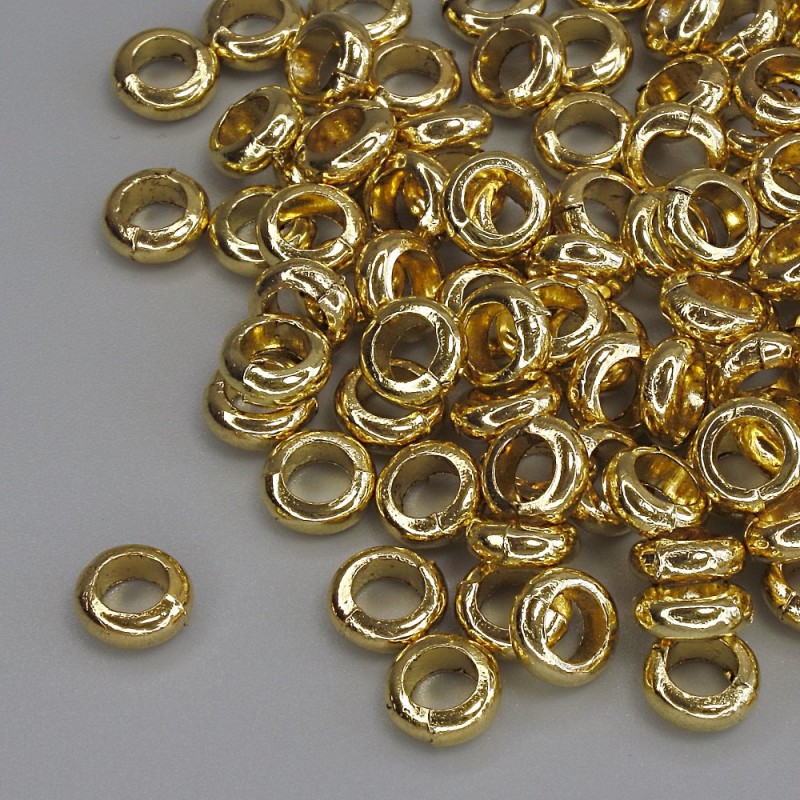 Furnitura jubilerska – koralik-wstawka w kolorze metalu złoto, średnica 6×2,5 mm, otwór Ø ok. 3,5 mm, opakowanie 20 g (~93 szt.)