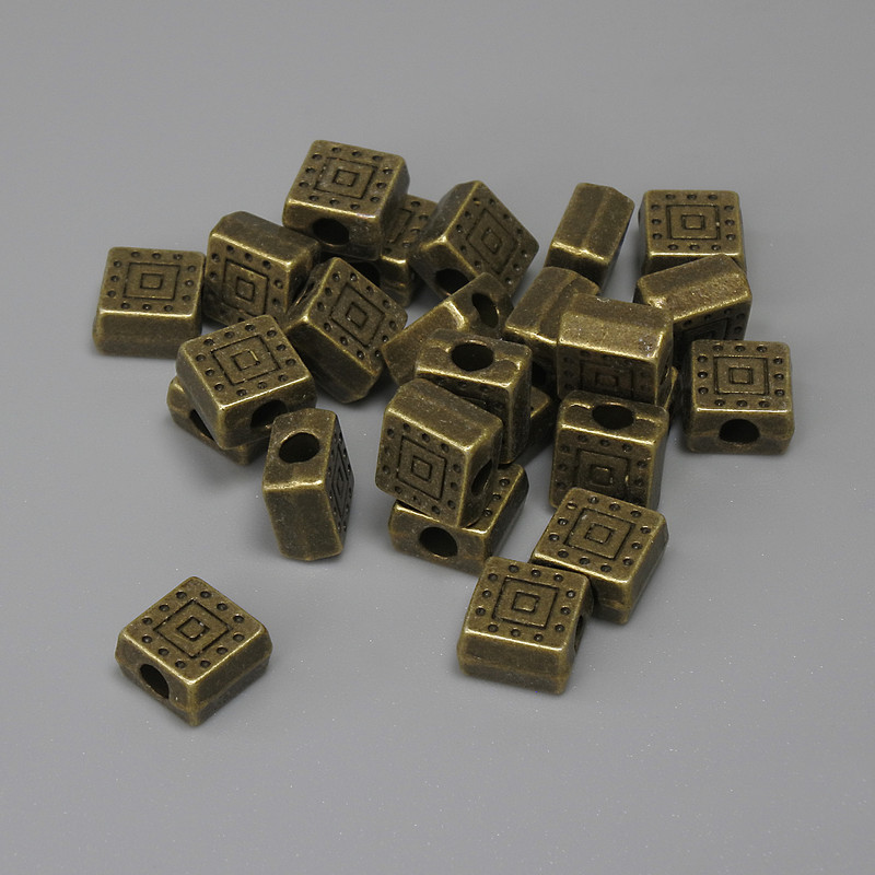 Brązowa koralika-wkładka, kolor metalu: brąz, średnica 6×6 mm ±, otwór ok. 2,3 mm ±, opakowanie 25 szt.