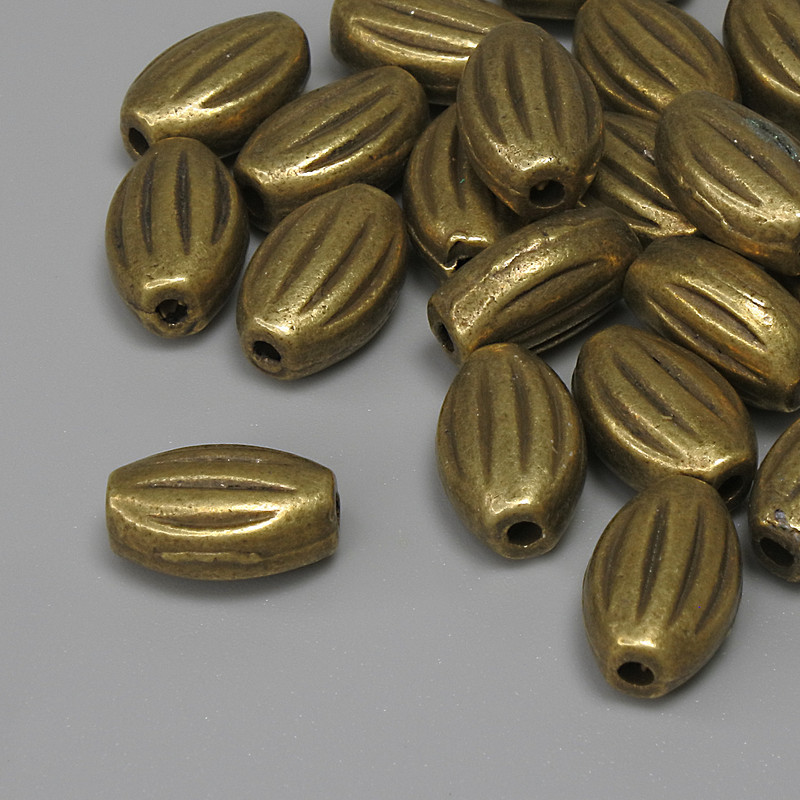 Furnitura – koralik-wstawka w kolorze brązu, średnica 10×7 mm ± otwór, średnica 1,8 mm ± opakowanie 25 szt. +