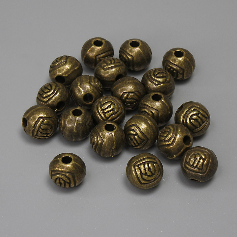 Koralik-wstawka w kolorze brązu, średnica 6 mm ±, średnica otworu 1,9 mm ±, opakowanie 19 szt.