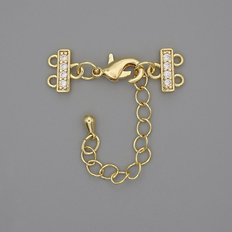 Zapięcie do bransoletek i koralików na dwie nitki ze strassami i przedłużającym łańcuszkiem, metal złocisty, średnica 7×12 mm, długość 3 cm