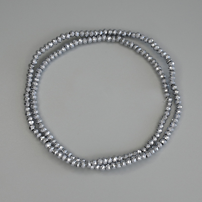 Koraliki hematitu w kolorze srebra, fasetowane w kształcie rondla 3x2 mm, na żyłce, długość 40 cm+