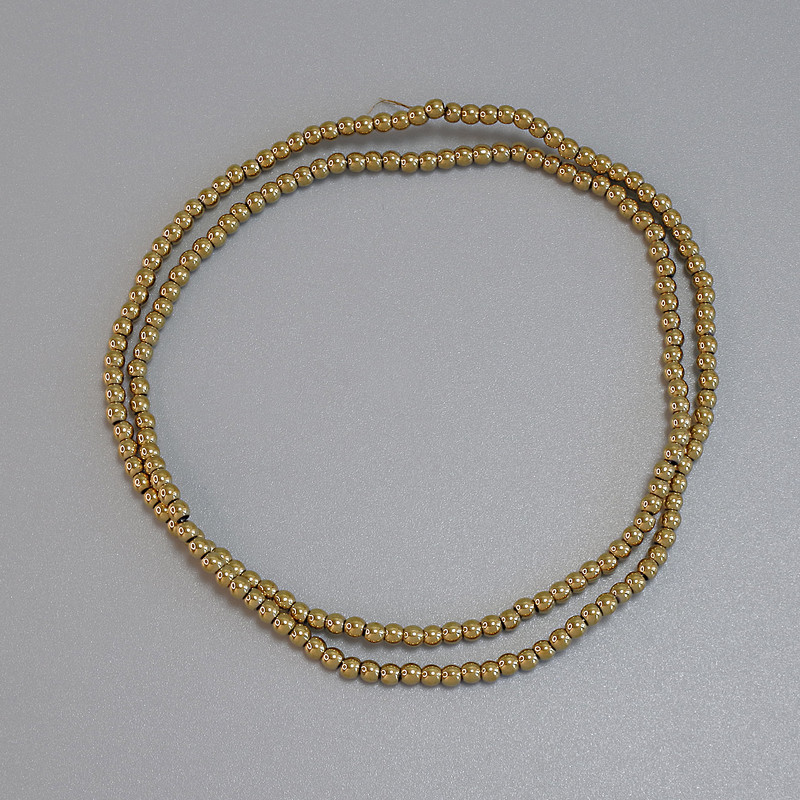 Koraliki hematitu złote, gładkie kulki 2 mm, na żyłce, długość ok. 38 cm