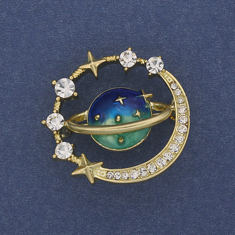 Broszka Planeta – emalia, białe kryształy, złoty metal, 30 mm+