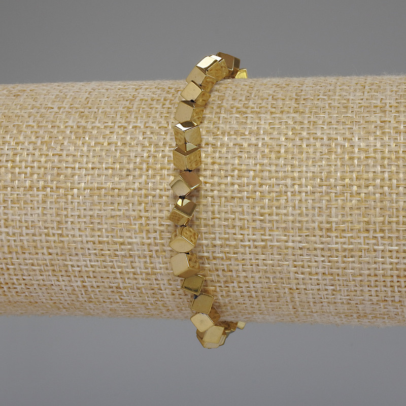 Bransoletka z hematitu w kolorze złota, kubik z poprzecznym otworem, średnica 4×4 mm, długość 18 cm, elastyczna