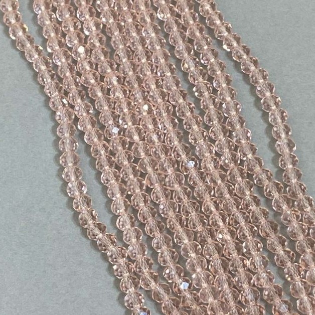 Koraliki czeskiego kryształu różowe, przejrzyste na żyłce, fasetowane rondelki, średnica 6×5 mm, długość 42 cm
