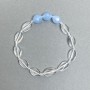 Bransoletka z kryształu górskiego, owal skręcany, średnica 12×8×4 mm + fasetowany koralik akwamaryny 10×8,5 mm, długość 18 cm, elastyczna