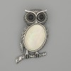 Broszka-kulon Sowa z perłowym połyskiem 45×25 mm ± czarne cyrkonie, metal srebrzysty