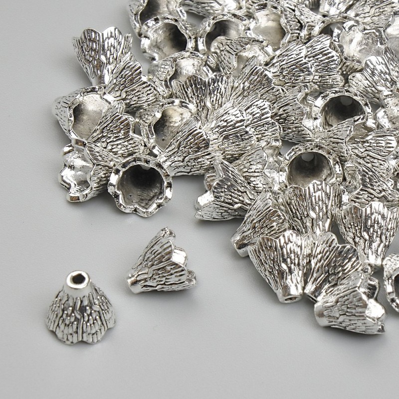 Końcówka biżuteryjna, średnica 6×6,5 mm, otwór ok. 1,8 mm, kolor metalu: srebrny, opakowanie 20 g (~50 szt.)