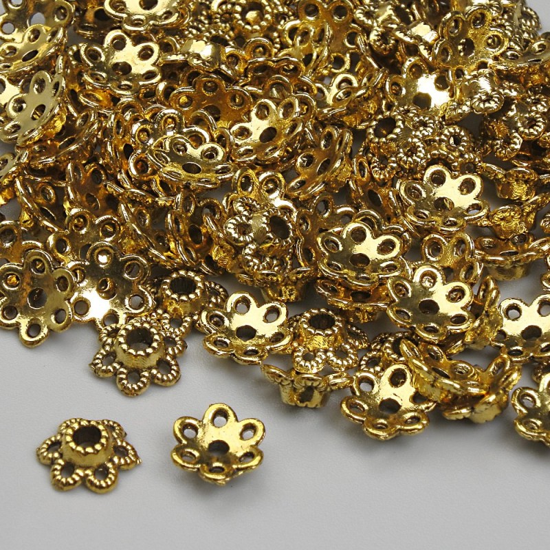 Czapeczki do koralików, kolor metalu złoty, średnica ok. 6 mm, otwór 2 mm, opakowanie 20 g (~112 szt.)