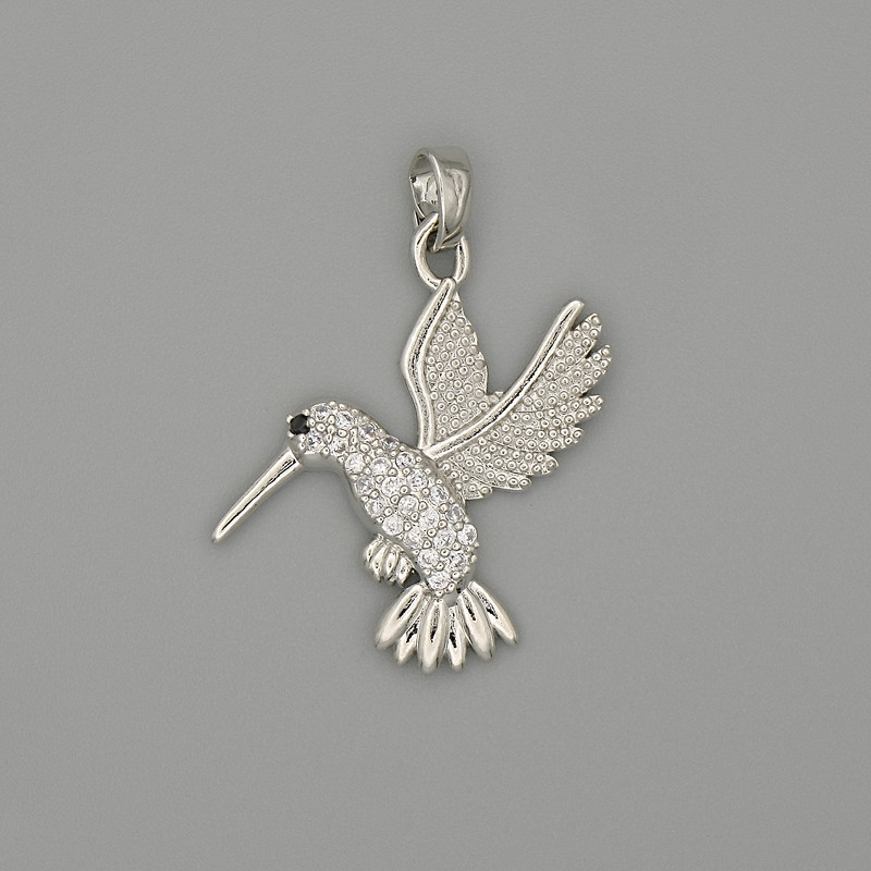 Wisiorek Koliber, srebrzysty metal, z białymi cyrkoniami, średnica 29×21 mm+