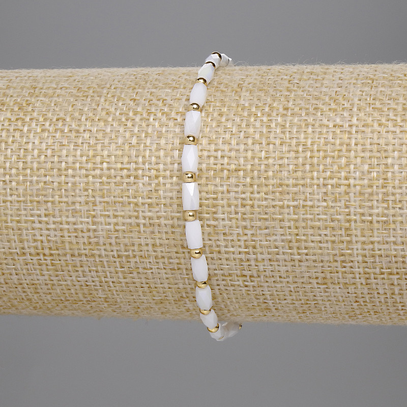 Bransoletka z czeskiego kryształu, biały fasetowany cylindryczny kryształ 5×3 mm, kuleczka 2 mm, długość 18 cm, elastyczna