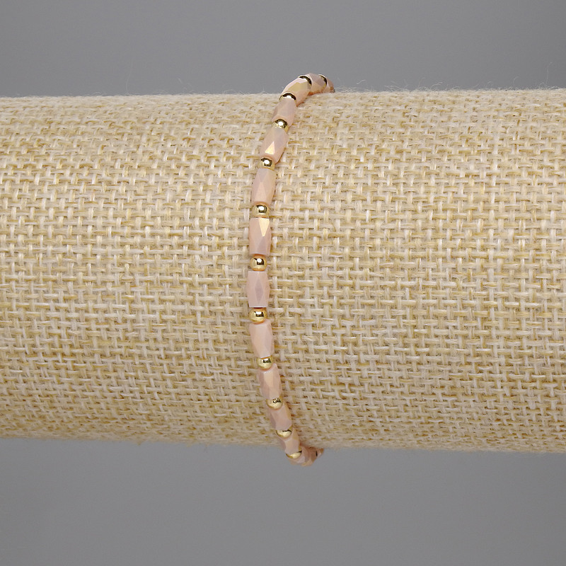 Bransoletka z czeskiego kryształu beżowa, fasetowany cylindr 5×3 mm ±, kuleczka 2 mm ±, długość 18 cm, elastyczna