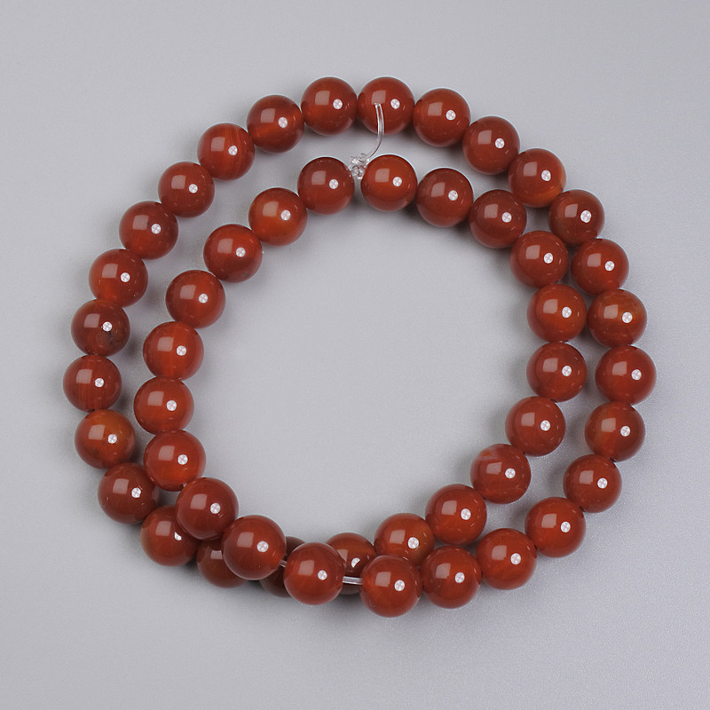 Koraliki z karneolu — gładkie kule, 8 mm, na nitce, długość 38 cm