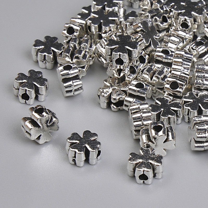 Koralik-wstawka w kształcie krzyża, kolor metalu: srebro, średnica 5,5×3 mm, otwór Ø 1,5 mm, opakowanie 20 g ≈ 115 szt.