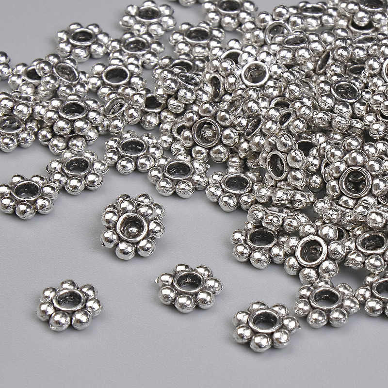 Koralik-wkładka w kolorze srebra, o średnicy 6×1,5 mm, otwór 1,5 mm, opakowanie 20 g ~115 szt. +