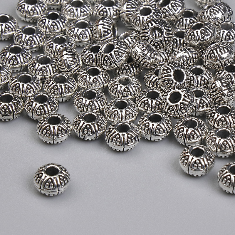 Koralik-wstawka w kolorze srebra, średnica 5×3 mm ± otwór, średnica 1,5 mm ±, opakowanie 20 g ~63 szt.