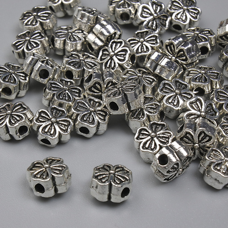 Koralik-wkładka w kształcie koniczyny, kolor metalu: srebrny, średnica 6 mm ± otwór 1,5 mm ± opakowanie 20 g ~41 szt. +