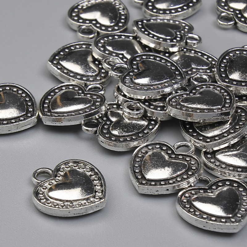 Wisiorek Serce, kolor metalu: srebro, średnica 13×11,5 mm, ± opakowanie 20 g (~21 szt.)