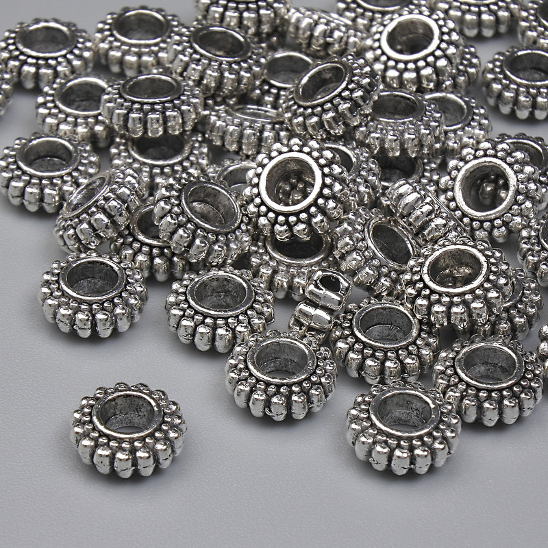 Koralik-wkładka w kolorze metalu: srebro, średnica 7×3 mm, otwór 2,8 mm, opakowanie 20 g (~41 szt.)
