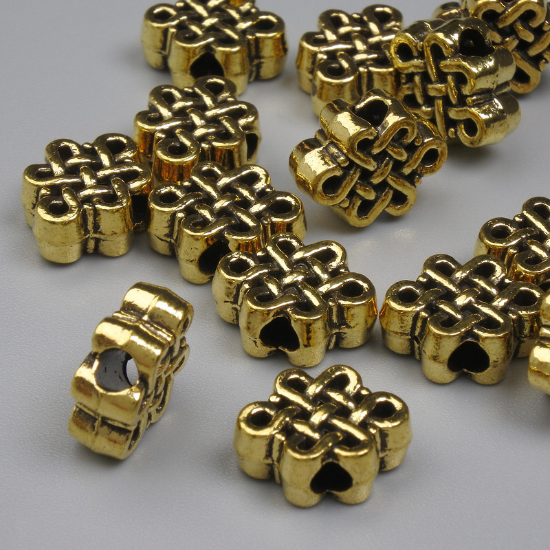Koralik-wkładka Węzeł nieskończoności, kolor metalu złoto, średnica 9×11,5 mm, otwór 2,5 mm, opakowanie 20 g (~14 szt.)