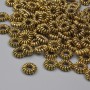 Koralik-wkładka, złoty kolor metalu, średnica 6×2 mm, otwór 2 mm, opakowanie 20 g (~94 szt.)