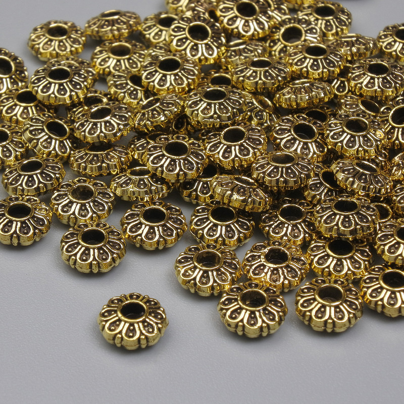 Koralik-wstawka w kolorze złotym, średnica 5,5×2,5 mm, otwór 1,8 mm, opakowanie 20 g (~94 szt.)