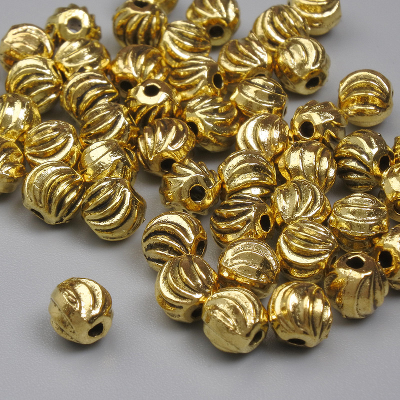 Koralik-wstawka w kolorze złotym, średnica 5 mm ± otwór 1 mm ± opakowanie 20 g (~52 szt.)