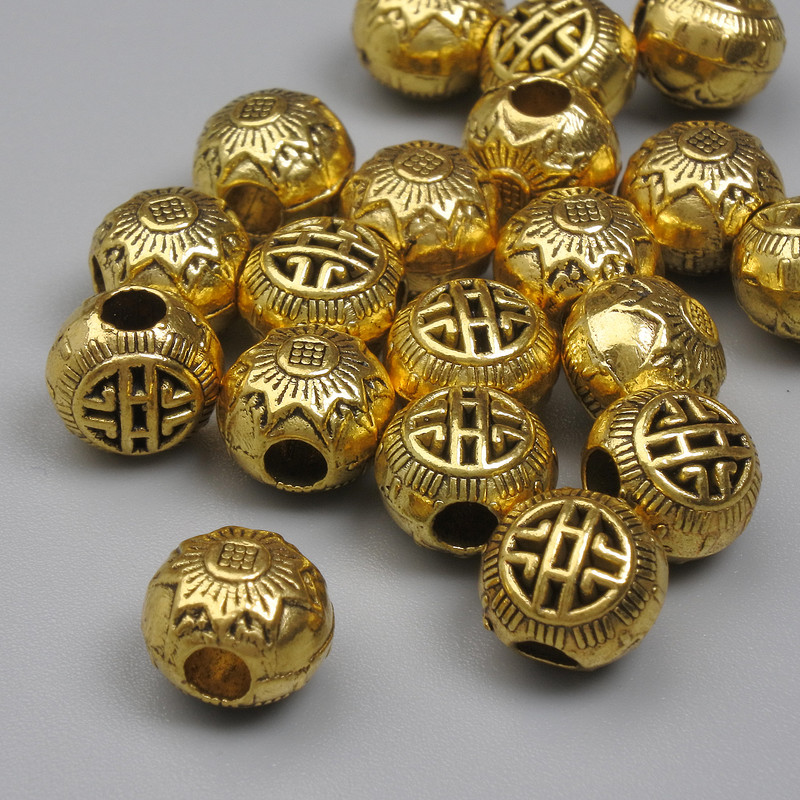 Koralik-wkładka w kolorze złotym, średnica 8 mm, średnica otworu 2,5 mm, opakowanie 20 g (~19 szt.)