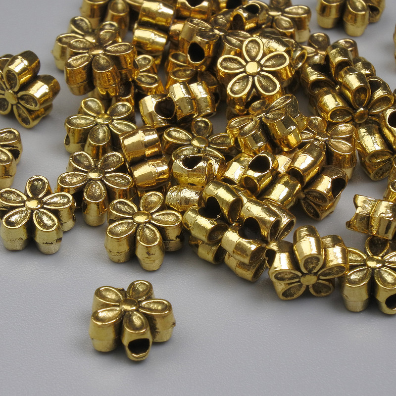Koralik-wstawka w kolorze złota, wymiar 7×3 mm ± otwór Ø 1,5 mm ± opakowanie 20 g (~47 szt.)