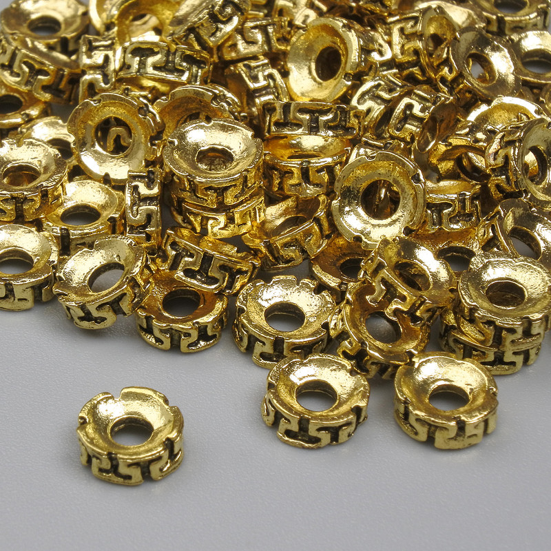 Koralik-wstawka w kolorze złotego metalu, średnica 6×2,5 mm, otwór 2,2 mm, opakowanie 20 g (~74 szt.)